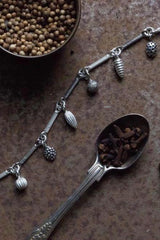 My Single Twisted Link Bracelet features 7 Mixed Pod Charms inspired by nature