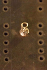 My Segmented Stigma Charm has a delicate striped texture and hangs at an angle