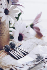 My Aster Daisy Drop Earrings feature a domed beaded flower head with three petals dropping down