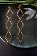 My Kiss Cross Drop Earrings in gold plated silver  link a row of three crosses or kisses