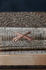 My Kiss Cross Ring is formed from a cross or kiss mounted on a simple band in rose gold plated silver