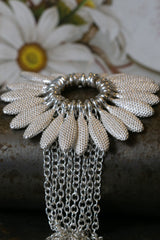 My Spotted Daisy Bracelet in all silver features a large bobbled petal charm flower