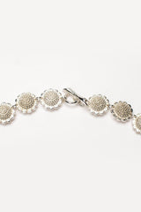 Fastening of my Sunflower Necklace linking sunflower heads to create a pleasing chain with a decorated reverse