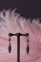 My Feather Drop Earrings in oxidised silver are hung with a feather charm