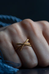 My Kiss Cross Ring is formed from a cross or kiss mounted on a simple band worn in gold plated silver