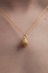 My Ball and Chain Pendant worn in gold plated silver features a medium sized ball charm, textured with bobbles and a plain base