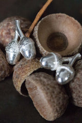 My Twin Acorn Stud Earrings feature a pair of acorns hanging from a small stud