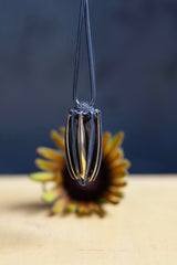 My Aster Pendant Necklace hangs like a tassel with its bobbled head fringed with a series of long elegant flowing petals that twirl pleasingly to create elegant movement and interest.