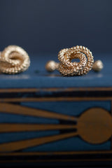 My Love Knot cufflink in gold plated silver uses a bobble texture and interlocking shape that symbolises never-ending love