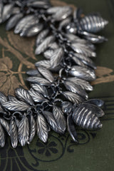 close up of Bee Mine Charm Bracelet inspired by poetry and is formed from multiple pairs of wing charms dancing as you move