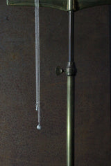 My Bauble Pendant features a medium sized finely striped ball that hangs from a long fine trace chain. It can be worn at two lengths and fastens with a bolt ring decorated with a small half ball charm.