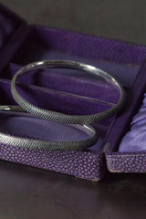 Pair of oval Dotty Bangles in oxidised silver decorated with my signature dotted texture