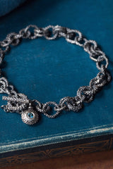 A chain bracelet made of recycled off cuts - personalise the charm with a gemstone