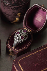 My Cobra Ring is textured with beads of silver set with 3 pink garnets