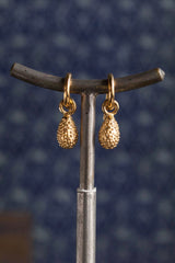 My Spotted Teardrop Drop Earrings are strung from a hooped sleeper