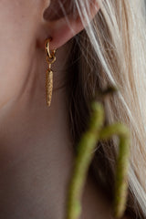 My Catkin Drop Earrings worn by a model feature a catkin-shaped charm