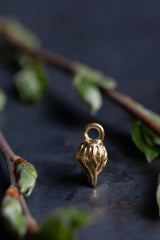 My Melting Droplet Charm is a pleasing tear drop shape adorned with a texture like molten metal.