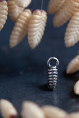 My Pupa Charm, inspired by bee hives, has pleasing stripes that catch the light