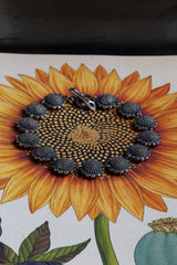 My Sunflower Bracelet features 13 delicate double sided sunflower heads side-by-side in ‘daisy’ chain