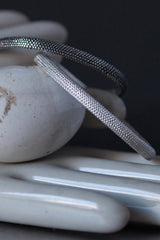 Pair of Dotty Bangles in silver and oxidised silver decorated with my signature dotted texture
