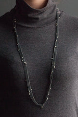 My Five Strand Trace and Pip Necklace comprises five delicate oxidised silver chains, decorated with miniature bright silver plated pips