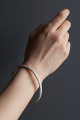 My oval Dotty Bangles worn in silver decorated with my signature dotted texture