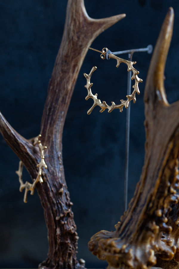 Antler earrings feature points around a curve like antlers