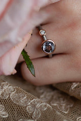 A one off Lilac Spinel in 18ct rose gold cup setting with a white diamond on 18ct white gold band