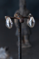 My Silver Cup Earrings curve round under the earlobe and hang from a stud