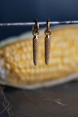 My Corn Drop Earrings are hung with a graceful textured charm inspired by corn cobs