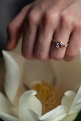 A one off Lilac Spinel in 18ct rose gold cup setting with a white diamond on 18ct white gold band