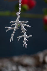 My unusual branch pendant, set with an Alexandrite, June's birthstone, hangs from a delicate trace chain