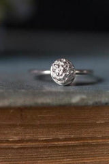 My Acorn Stacking Ring features a central textured dome nestling in an acorn cup inspired by woodland