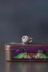 A delicate striped gemstone charm – choose an Amethyst for your February birthday.