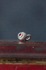 A delicate striped gemstone charm – choose a red Garnet for your January birthday month.