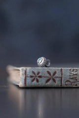 A delicate striped gemstone charm – choose an Aquamarine for your March birthday.