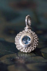 An elegant charm with a bobbled pattern – choose an aquamarine for your March birthday