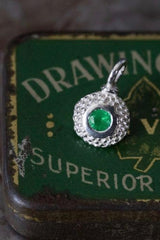 An elegant charm with a bobbled pattern – choose an Emerald for your May birthday