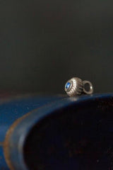 A delicate striped gemstone charm – choose a Sapphire for your September birthday.