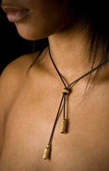 An elegant tassel pendant on a snake chain with two textured lozenge beads that customise how the necklace falls