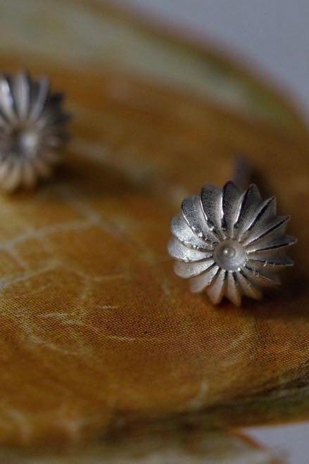 My Satsuma Studs in silver are decorated with subtle stripes that catch the light