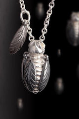 My Tiny Bee necklace features a chunky pendant on a fine chain with an extra bee's wing on the chain.