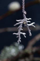 My unusual branch pendant, set with a Diamond, April's birthstone, hangs from a delicate trace chain that can be worn at two lengths, is sure to appeal to nature lovers.