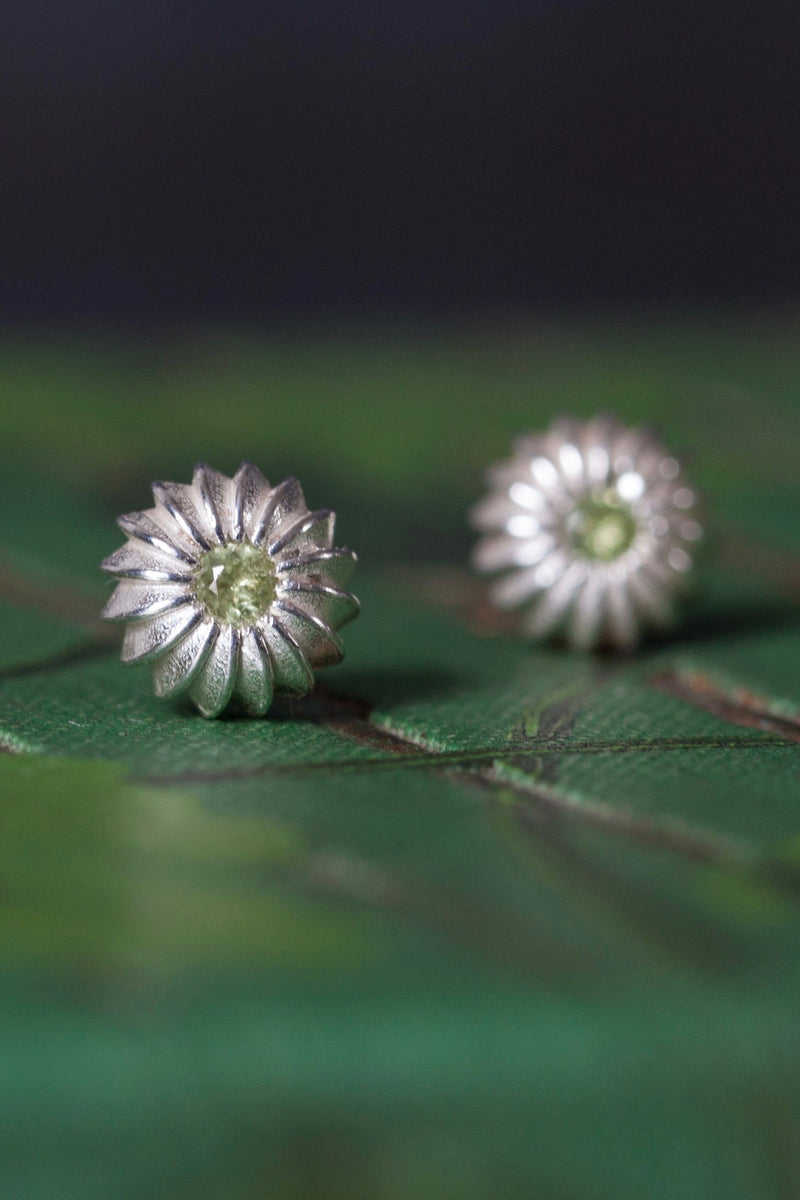 My August Peridot Birthstone Satsuma Studs are subtly striped and set with gemstones