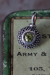 An elegant charm with a bobbled pattern – choose a Peridot for your August birthday