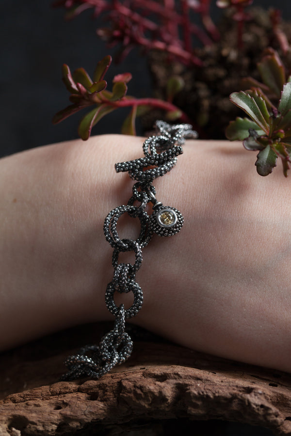 A chain bracelet made of recycled off cuts - personalise the charm with a gemstone