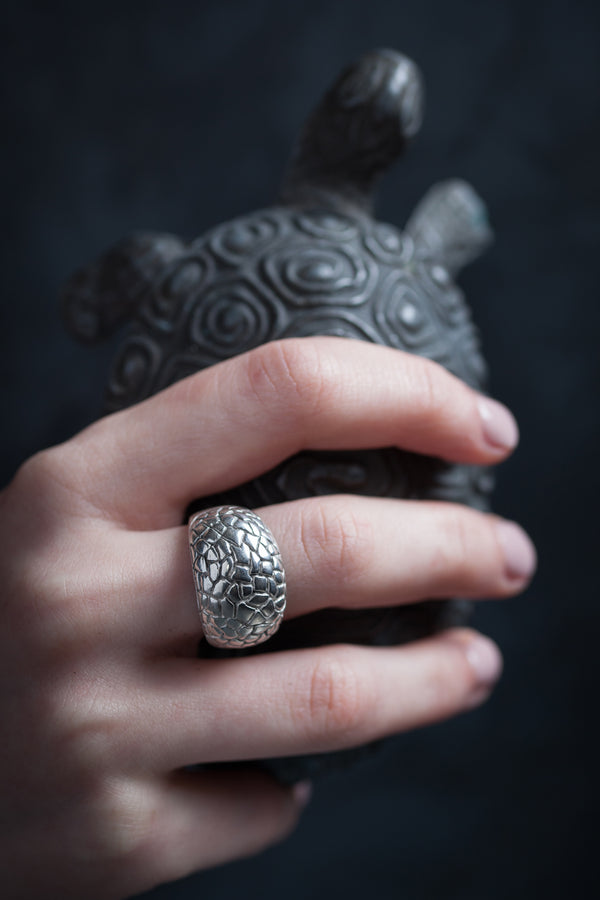 A chunky Turtle Ring worn in silver inspired by the geometric pattern of a turtle shell