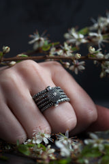 My unusual Diamond Bobbled Five Band Ring worn by a model with a bobbled button set with a diamond 