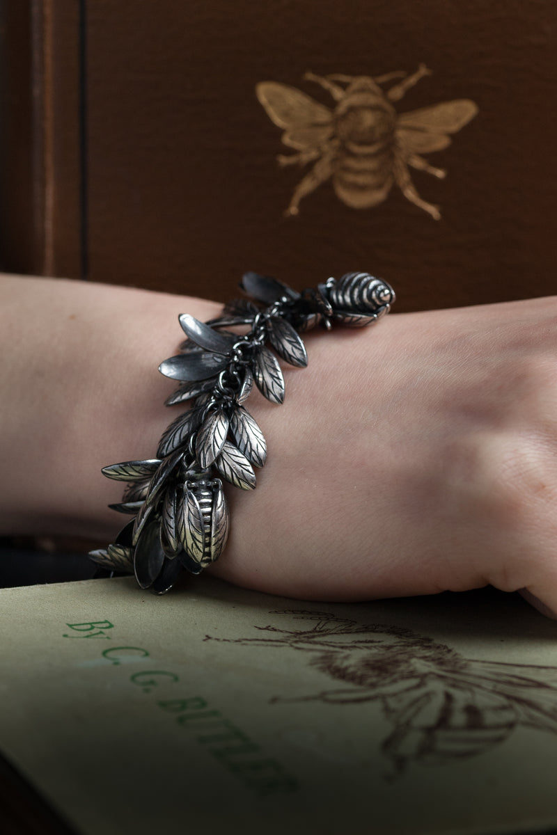 My Bee Mine Charm Bracelet worn by model was inspired by poetry and is formed from multiple pairs of wing charms dancing as you move