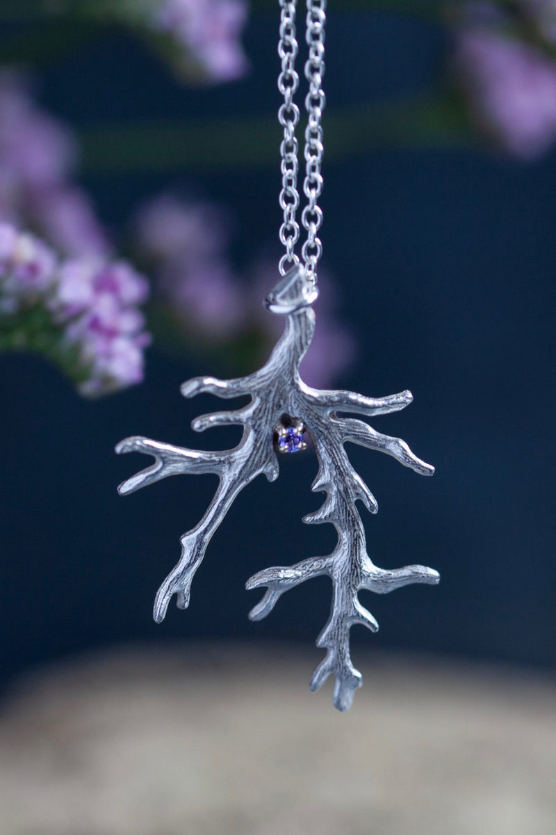 My unusual branch pendant, set with a Tanzanite, December's birthstone, hangs from a delicate trace chain that can be worn at two lengths